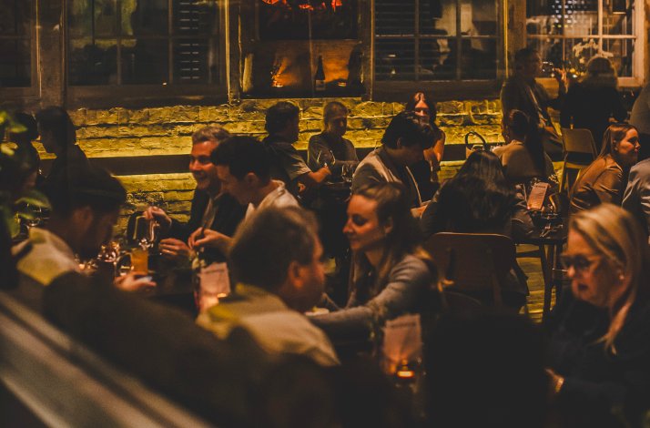 Packed dining area of the Firedoor restaurant in Surry Hills, Australia.