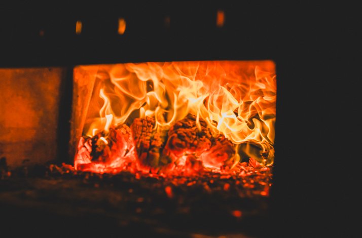 A close-up of an open fireplace.