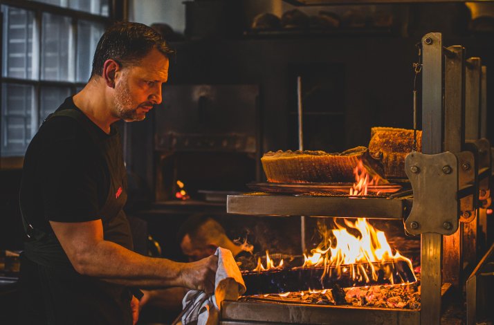 Chef Lennox Hastie flame cooking at Firedoor restaurant in Surry Hills, Australia.