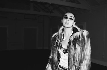 Promotional banner for Charli XCX.