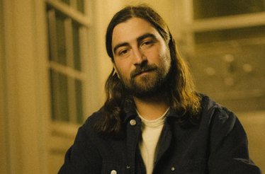 Promotional photo of music artist Noah Kahan.