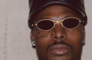 Promotional headshot of music artist Asake.