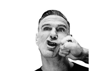 Promotional photo of music artist Bryan Adams, punches on his face