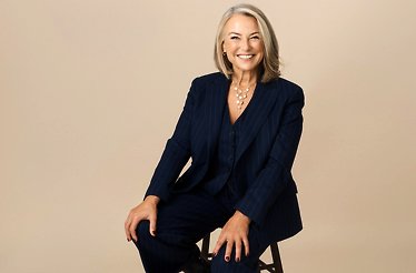 Promotional banner for STRANGERS FRIENDS AND LOVERS A Night Out with Esther Perel showing Esther Perel seating on a stool.