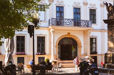 View at the main entrance and terrace of the Epoca Bella restaurant at day.