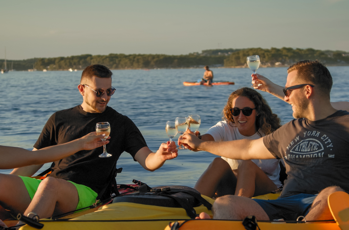 Couple of mates enjoying their day with glasses of wine.