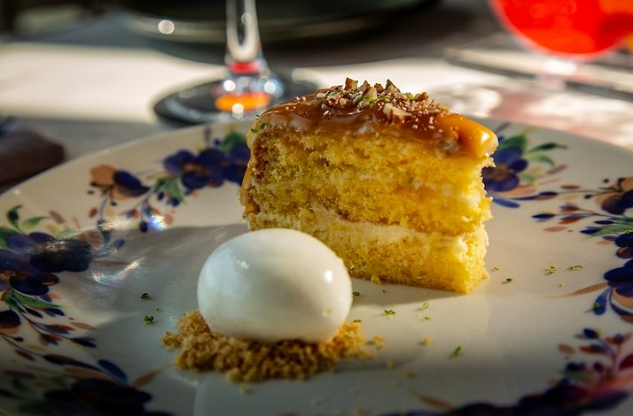 LEMON PIE WITH CARAMEL Served with nuts and yogurt ice cream served in Arango restaurant.