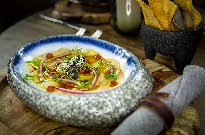 A close shot of a vegetable dish served on the decorative plate in Cachava steakhouse