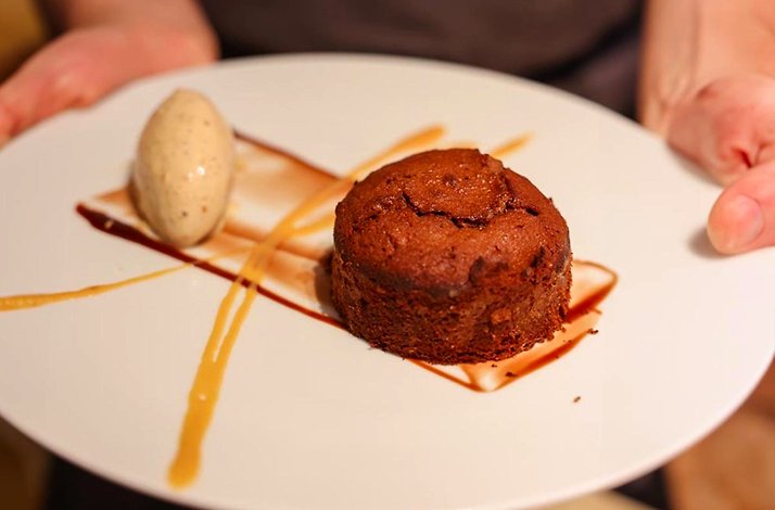 A chocolate cake with marzipan ice cream served at Mexico City's Casa Ó restaurant