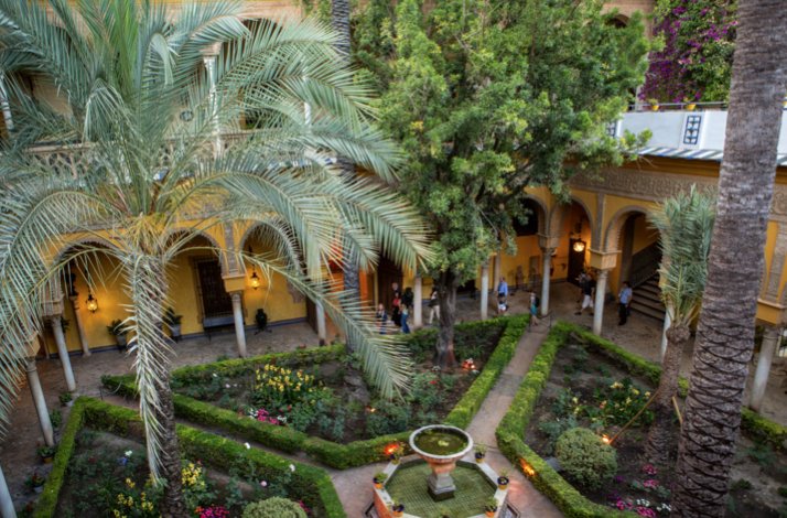 Visit Seville's Palacio de Las Dueñas with exclusive upper-floor access: In Seville, Spain The beautiful yard of Palacio de Las Dueñas