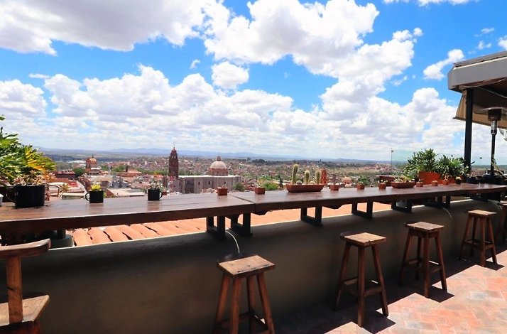 Dining area in the balcony of the Antonia Rooftop Restaurant with a view of San Miguel de Allende.
