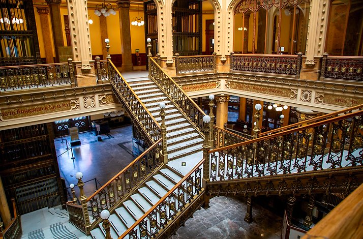 The interior of Mexican building featuring stairs to second floor