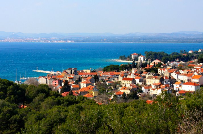 Kayak through the Šibenik archipelago on a land-and-sea adventure: In Zlarin, Croatia Longshot photo of the city of Šibenik