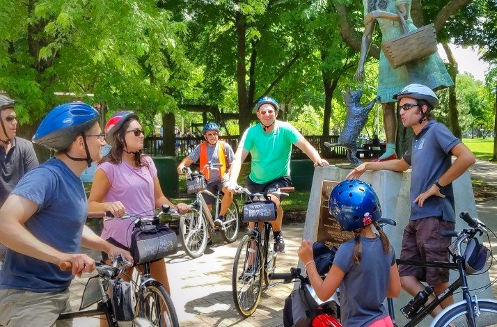 Tour group photographed in Oz Park next to the statue of Dorothy and Toto.