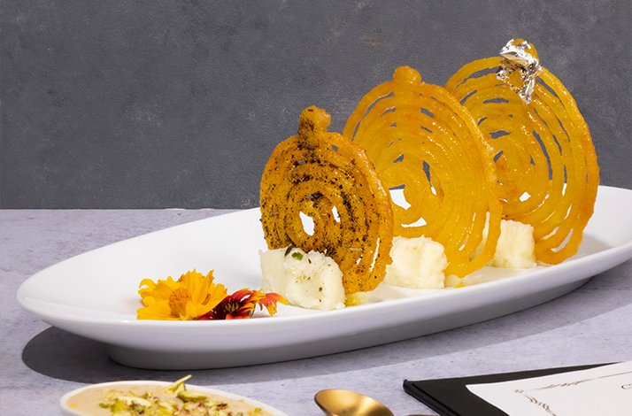 A modern indian cuisine dish served with artful plate at Varq restaurant.