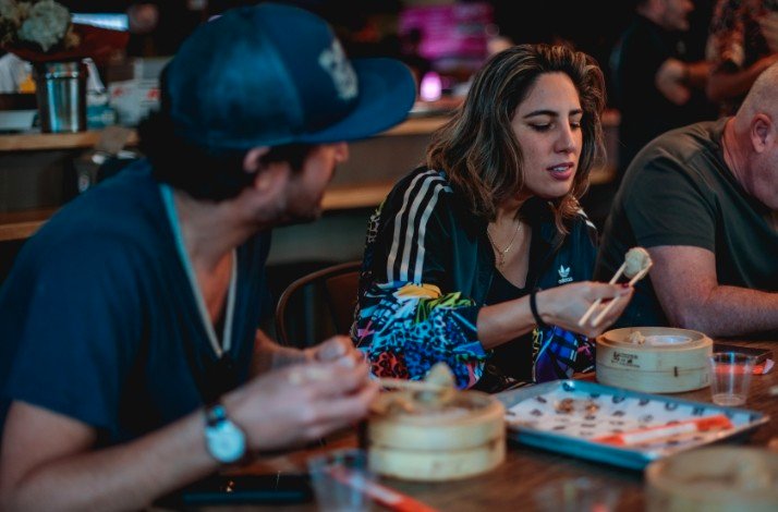 A couple enjoying the dishes of Phoenix restaurant.