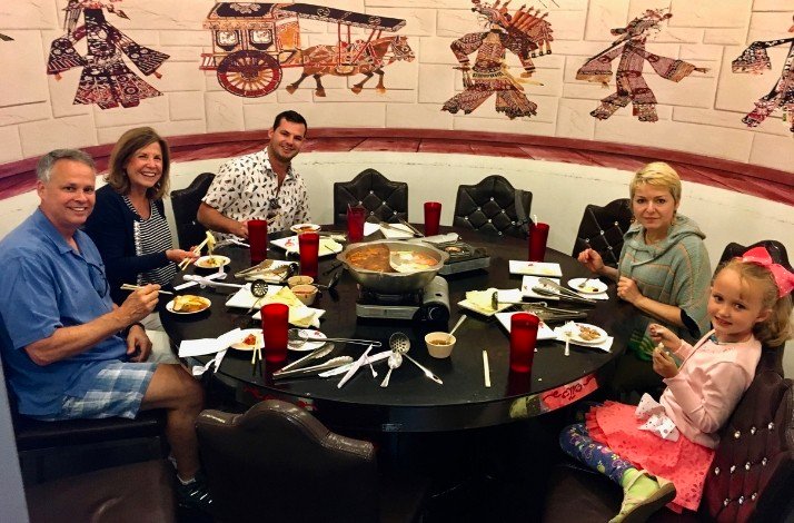 A family sitting at the table in the Phoenix restaurant.