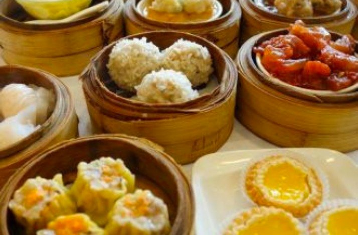 Freshly prepared Chinese dish served on a wooden plate at Phoenix Restaurant.