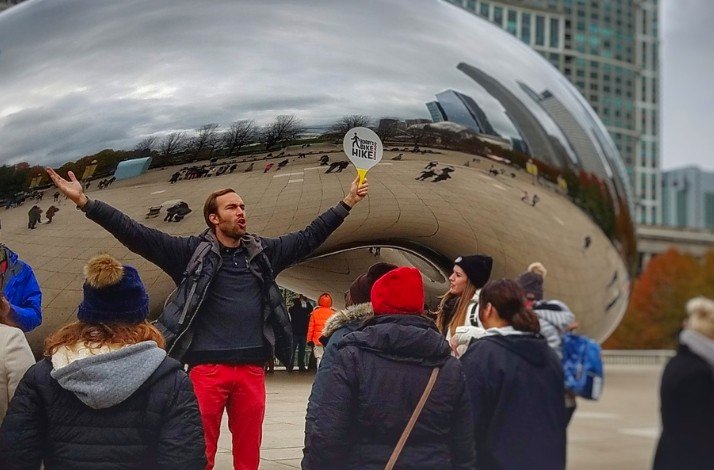 A person exposing the Cloud Gate in Chicago