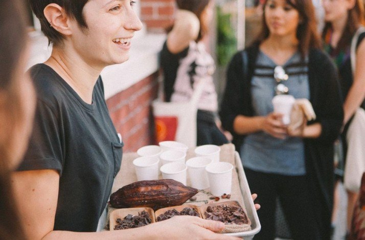 A person serving chocolate and sweet cocoa tests