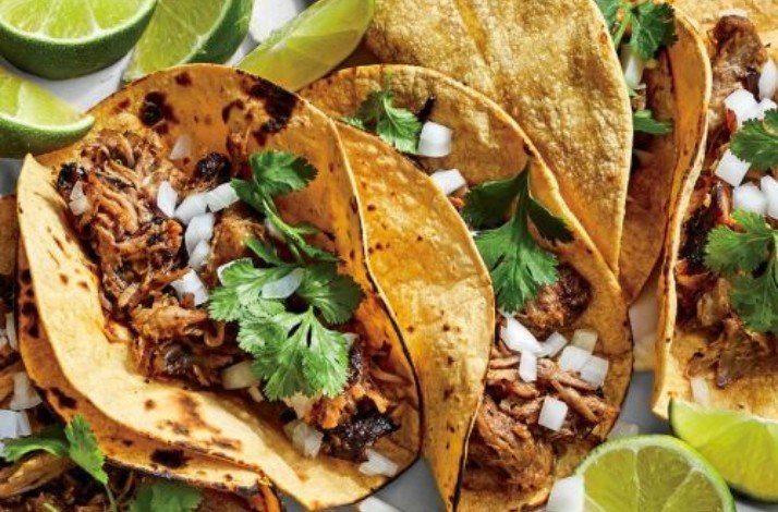Tacos with meat, onion and veggetables inside
