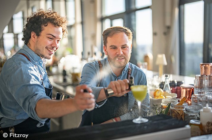 Two bartenders preparing a drink. © Fitzroy