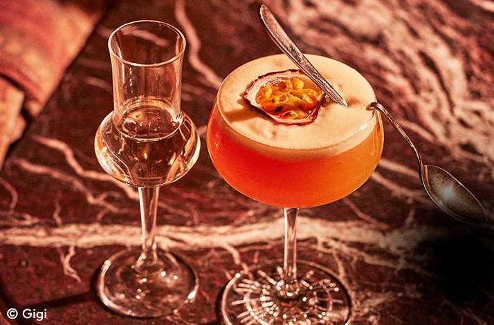 Two elegantly presented drinks in unique glassware. © Gigi