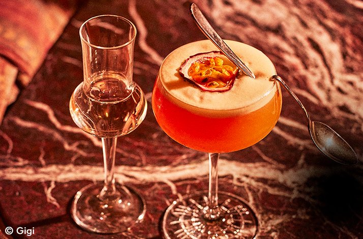 Two elegantly presented drinks in unique glassware. © Gigi