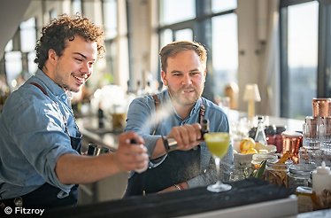 Two bartenders preparing a drink. © Fitzroy