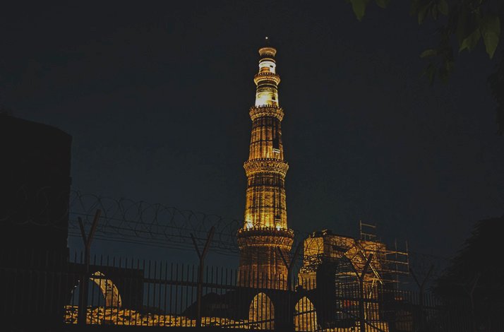 Night view of Qutab Minar monument in India
