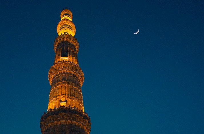 Night view of Qutab Minar monument in India