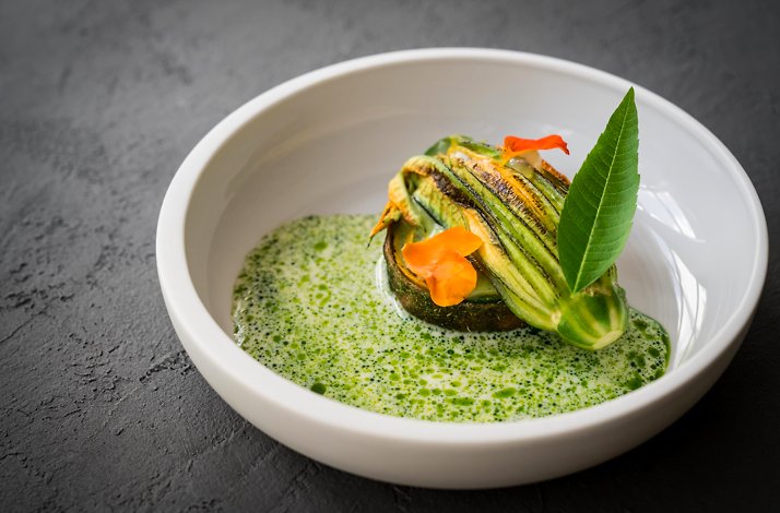 An exquisite dish garnished with courgette flower at Aroma.