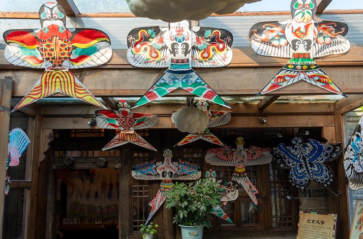 Create traditional Chinese handicrafts in Beijing, China during the tour.