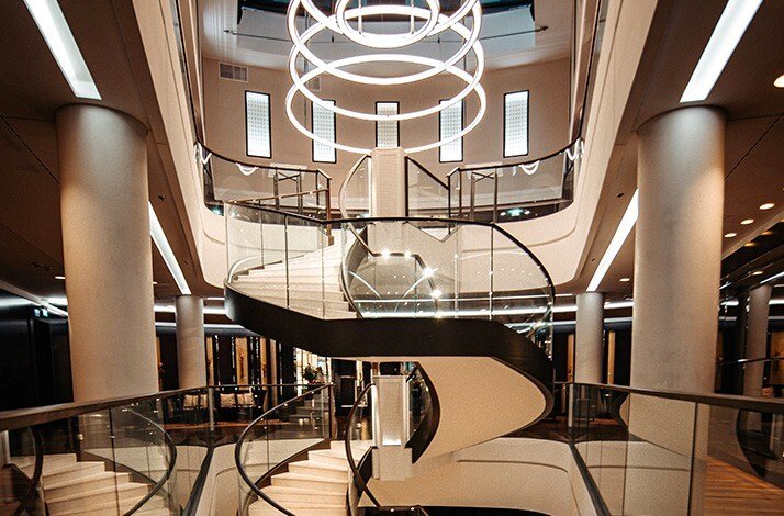 The dramatic geometric spiral staircase inside the Waldorf Astoria Berlin hotel.