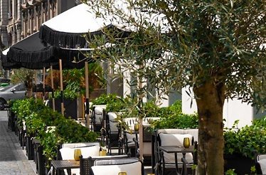 The outside dinning place with umbrellas on it at The Marmorosch - The Reserve.