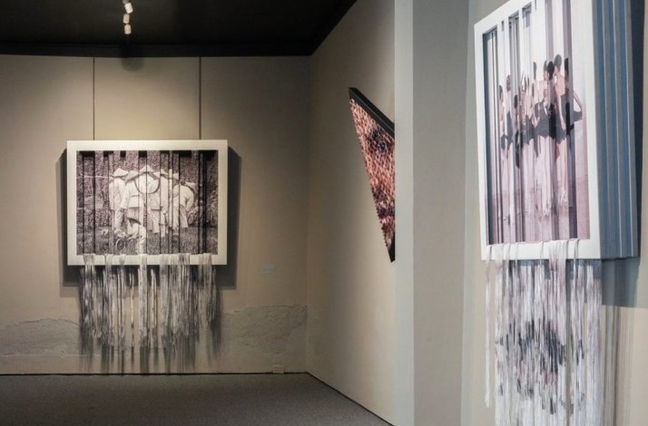 Exhibition room with paintings and sculptures