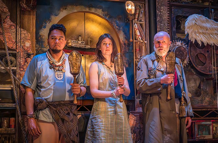 Three actors acting during a Shakespeare's The Tempest play at the Sam Wanamaker Playhouse in London