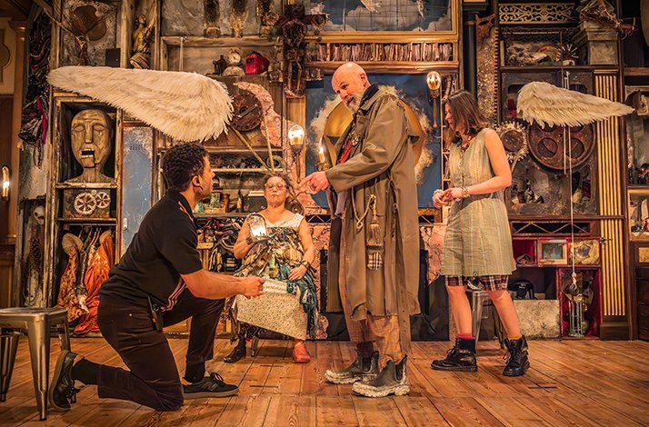 Four actors acting during a Shakespeare's The Tempest play at the Sam Wanamaker Playhouse in London