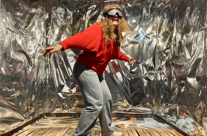 A person in special glasses enjoying the experience at the Hangover Museum