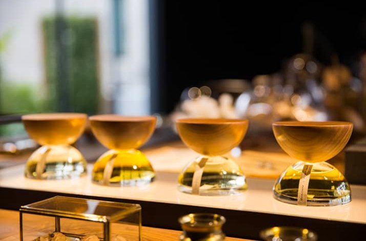 Perfumes displayed on a shelf at Xinú.