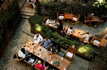 People having dinner at terrace at Casa Boema. 