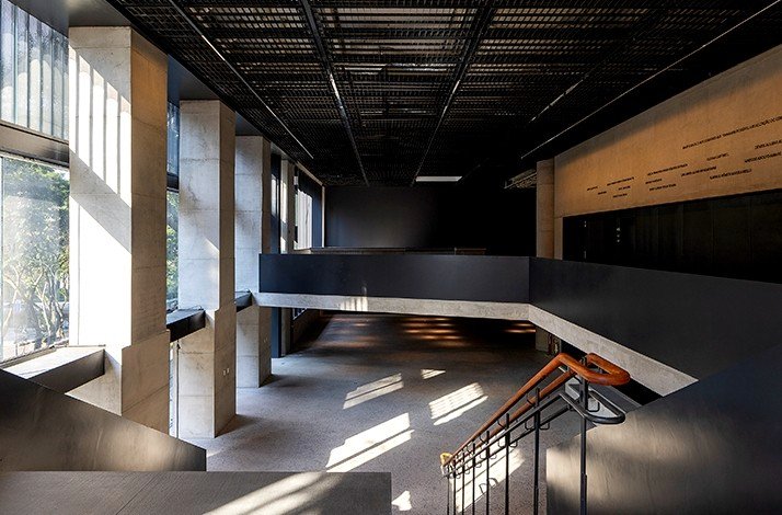 A modern architectural interior of Pietro Maria Bardi with strong lines, contrasting textures, and a play of light and shadow.