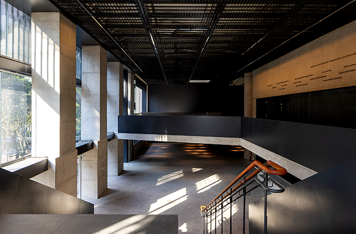 A modern architectural interior of Pietro Maria Bardi with strong lines, contrasting textures, and a play of light and shadow.