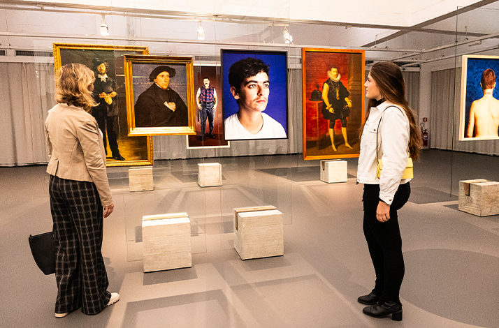 Two women looks at the art pieces in one of São Paulo Museum of Art showrooms during after-hours tour. 
