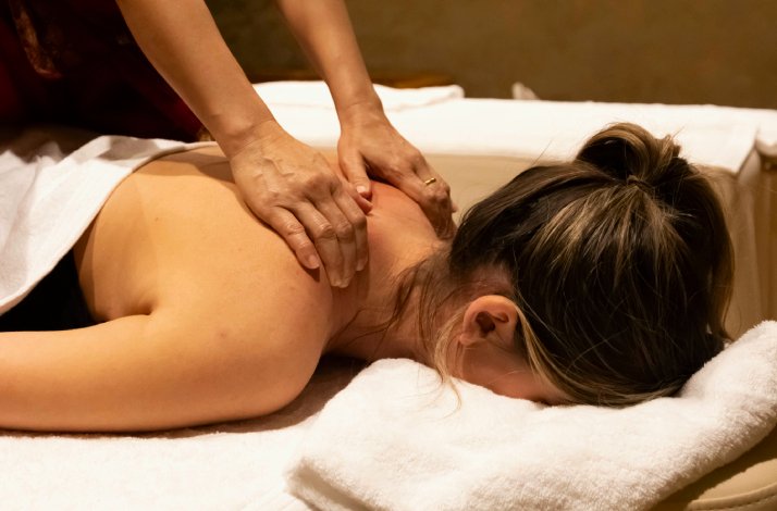 Close-up of a woman on a massage bed during back massage at Thai Centre Mali massage center located in Zagreb, Croatia.