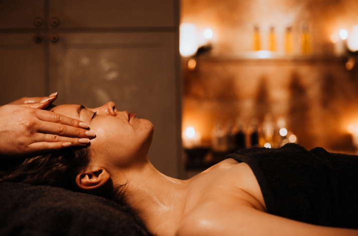A  masseur is performing the facial massage on the lady at the Rena Spas