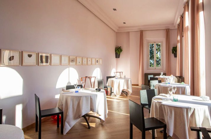 Dining area of the La Leggenda dei Frati restaurant furnished in pink, Florence, Italy.
