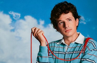 Promotional banner for Charlie Puth.