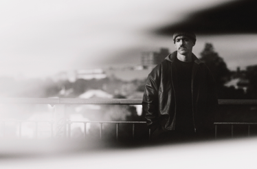 Promotional banner for Tom Scott.