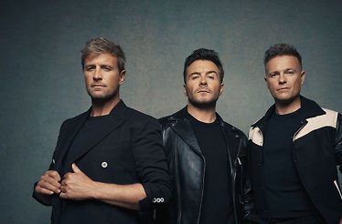 Promotional banner for Westlife: 25 The Anniversary World Tour.